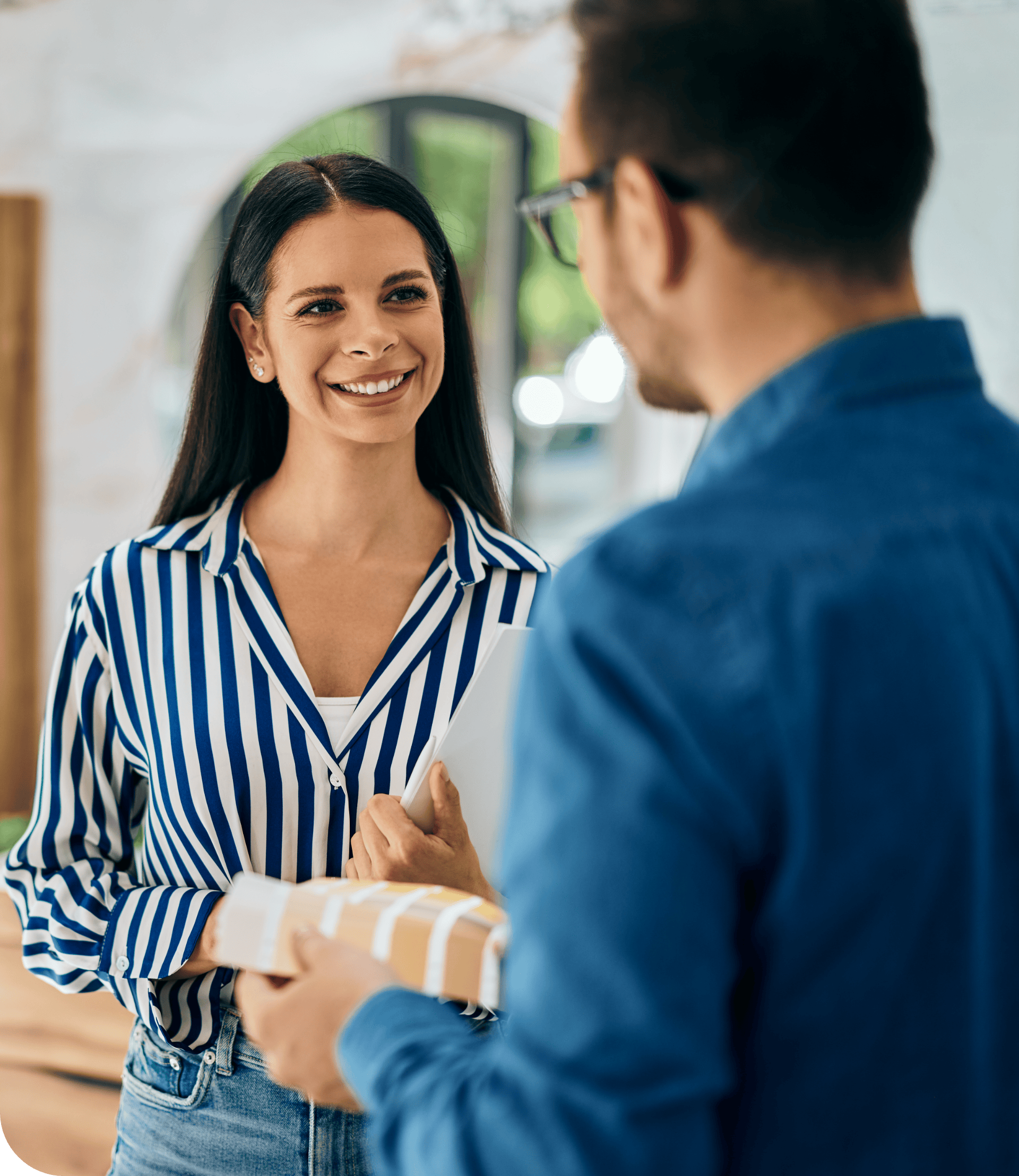 Houston, Texas, homeowner greeting Texas Pride AC & Heating employee at front door.